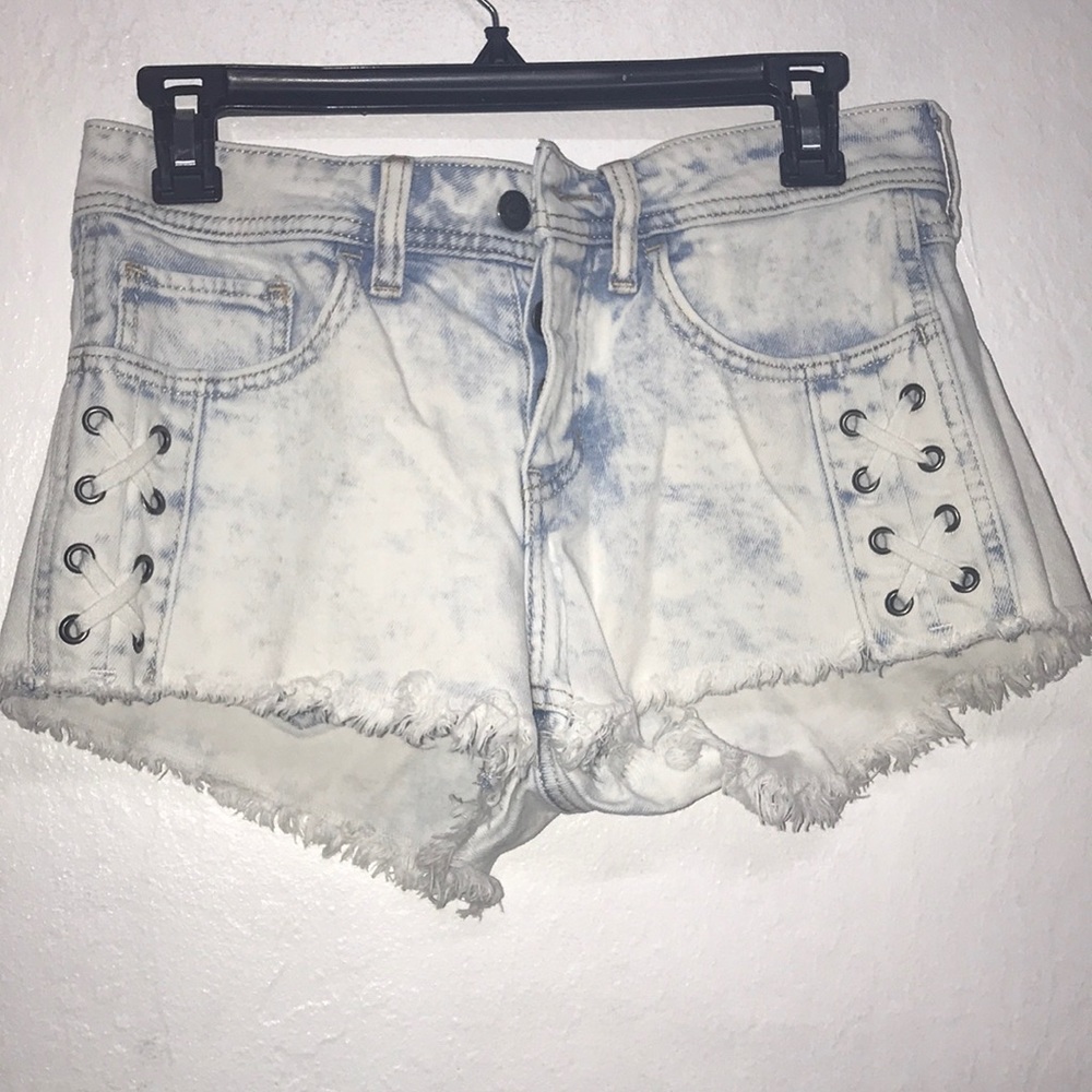 white and blue light washed jean shorts